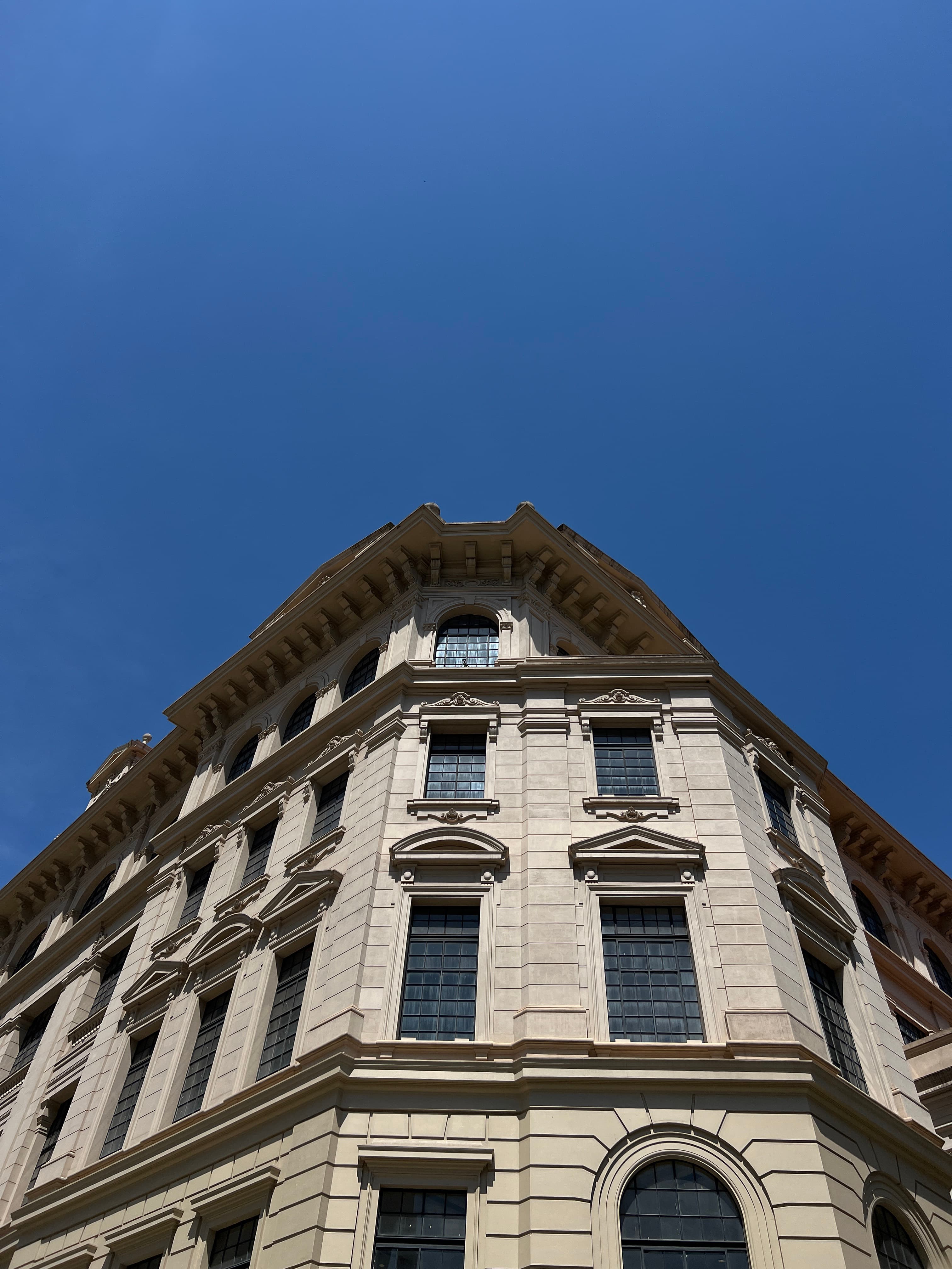 A build with a lot of windows and blue sky